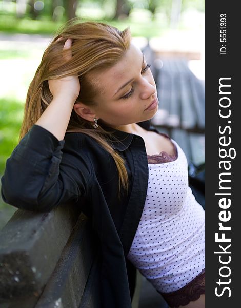 Portrait of the beautiful young girl on nature