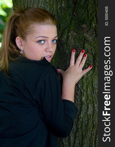 Portrait of the beautiful young girl on nature