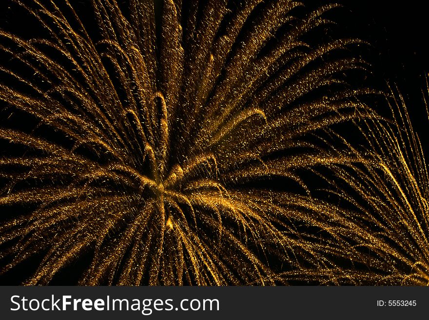 Yellow fireworks in black sky. Yellow fireworks in black sky