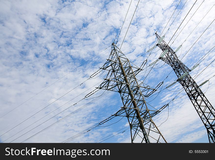 High voltage power line pillar on the background of sky