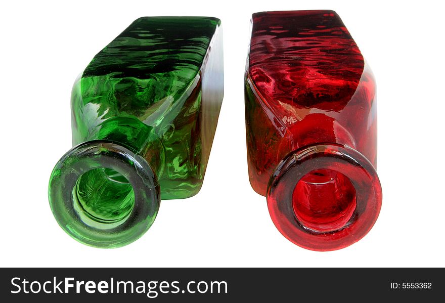 Red and green decorated bottles on white
