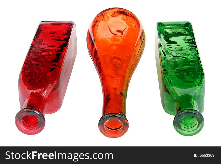 Red and green decorated bottles on white