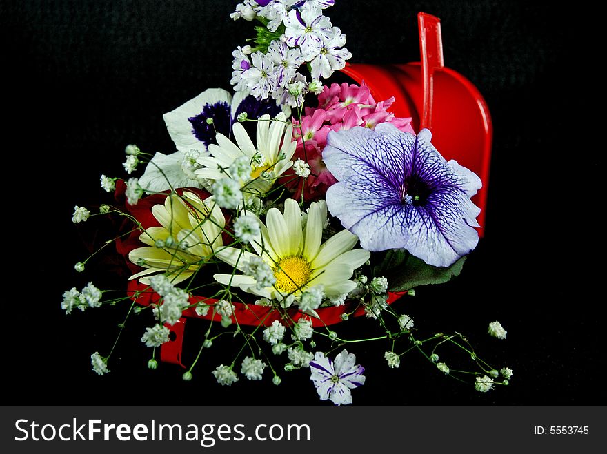 Fresh flowers in a red mailbox. Fresh flowers in a red mailbox.