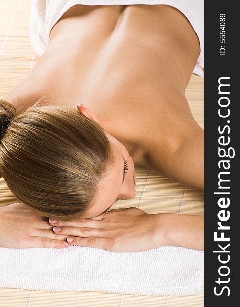 Young beautiful woman in a spa with towels. Young beautiful woman in a spa with towels