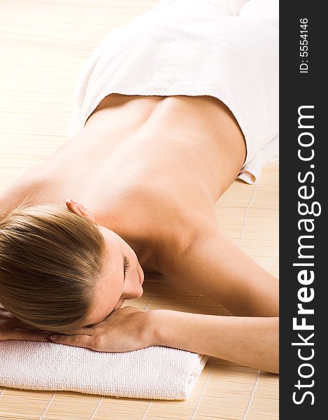 Young beautiful woman in a spa with towels. Young beautiful woman in a spa with towels