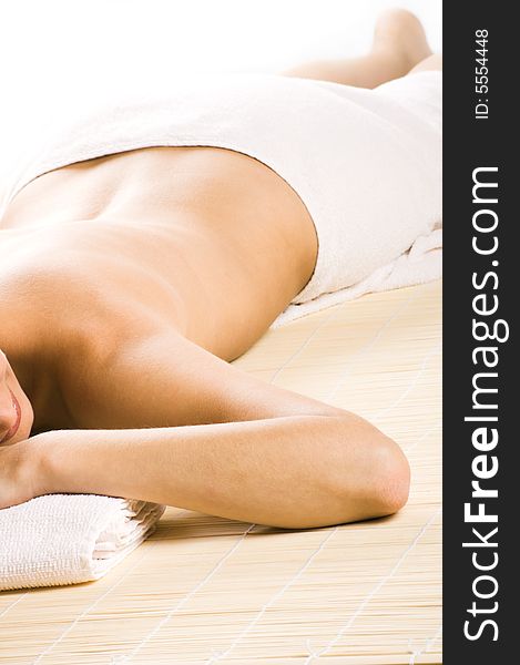 Young beautiful woman in a spa with towels. Young beautiful woman in a spa with towels