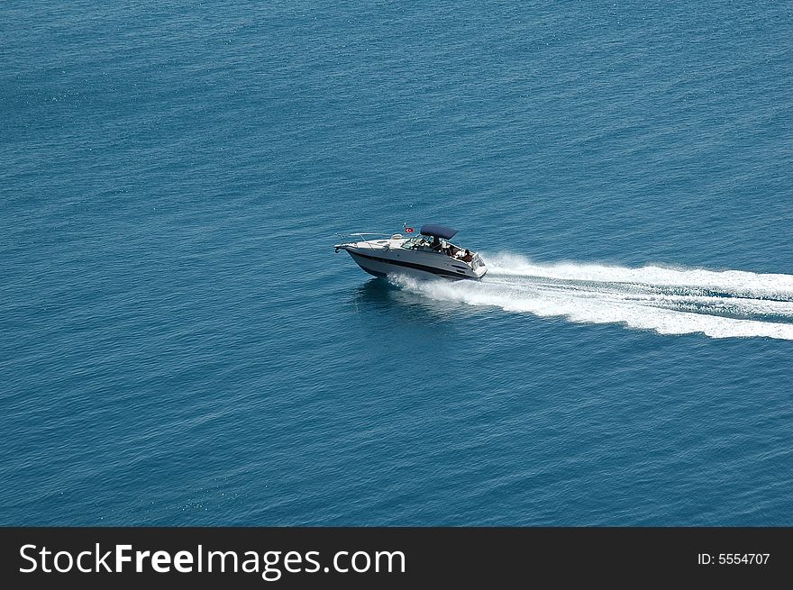 Speedboat cruising in the blue mediterranean