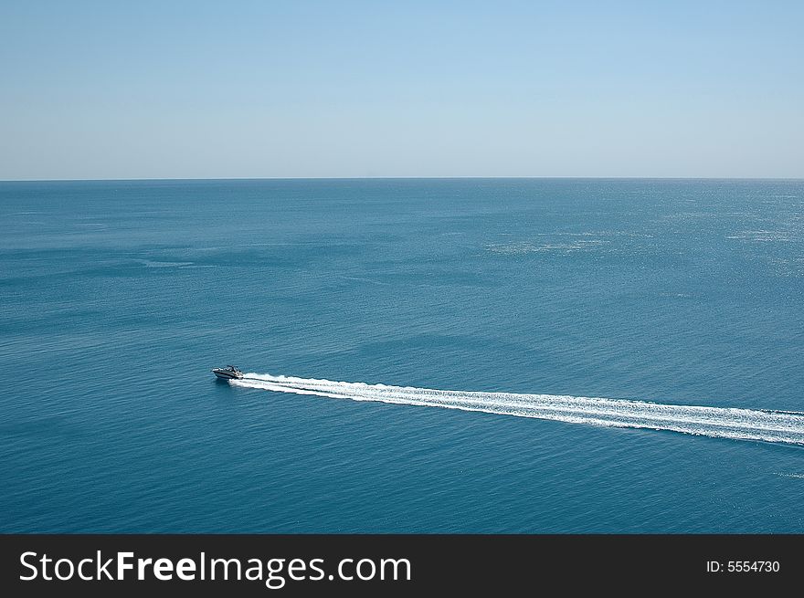 Speedboat cruising in the blue mediterranean