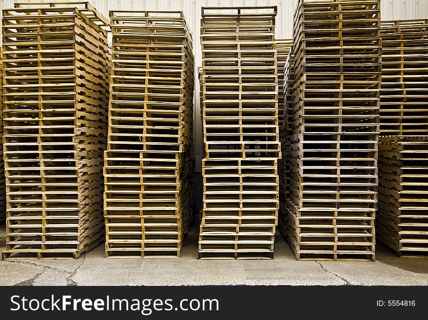 Stacks of wooden shipping pallets