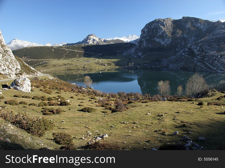 Lake between mountains with reflection in a water. Lake between mountains with reflection in a water