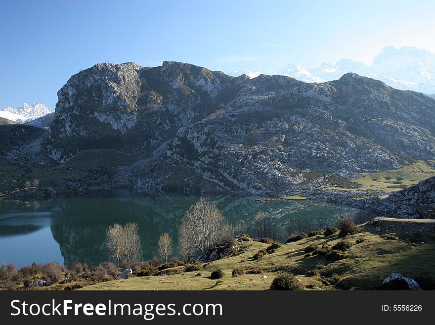 Lake in a mountains with their reflection in a water. Lake in a mountains with their reflection in a water