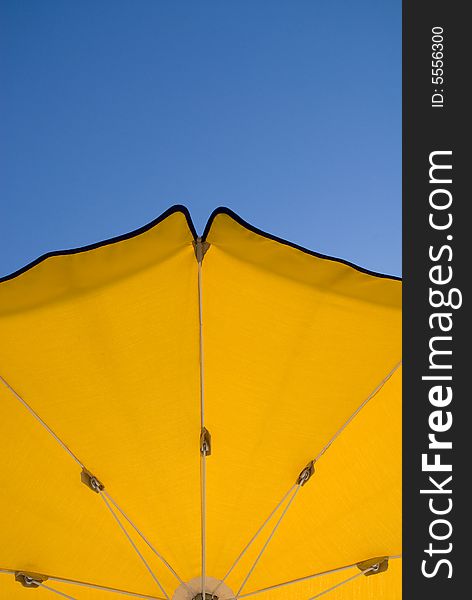 Beach umbrella on a beautiful blue sky. Beach umbrella on a beautiful blue sky.