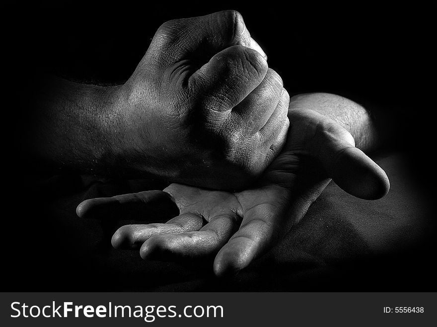 Close-up hands of the man over black. Close-up hands of the man over black