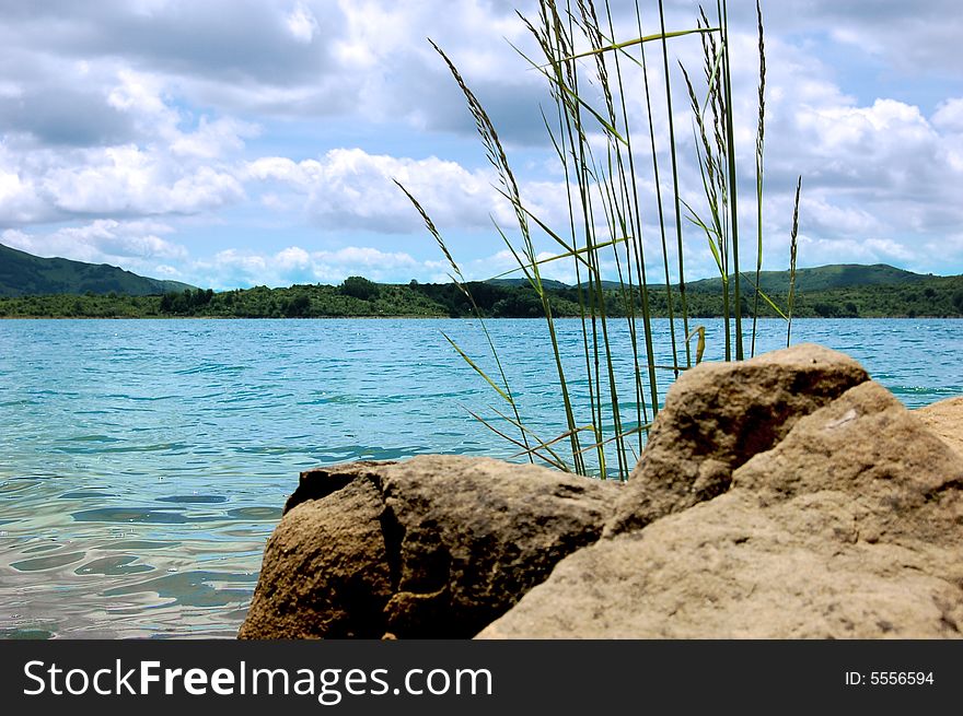 Stone, lake, mountains, sky, this is a nature whole. Stone, lake, mountains, sky, this is a nature whole.