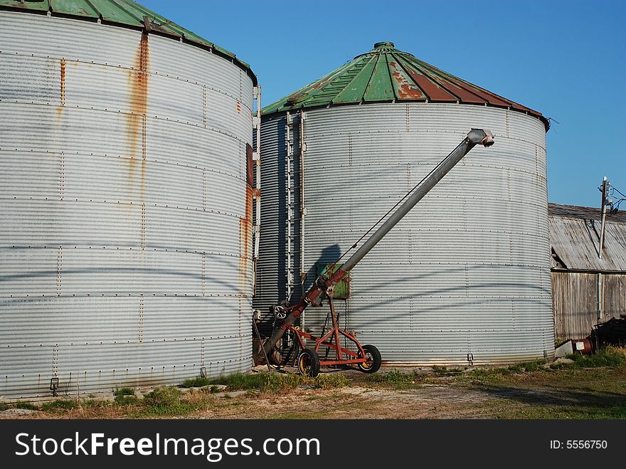 Rusty vintage Crop Storage bin with blue sky. Rusty vintage Crop Storage bin with blue sky