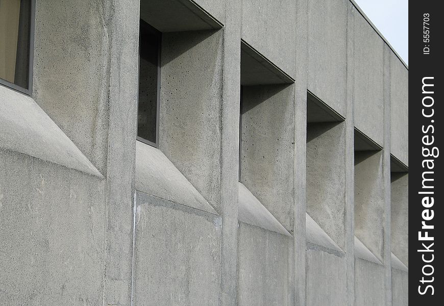 The grey exterior of a cement building