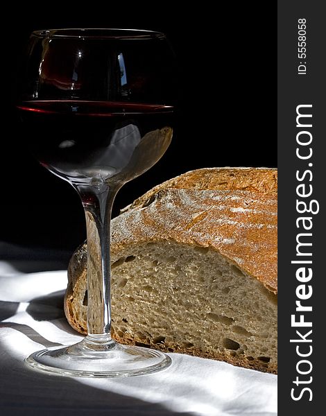 Glass of  red wine and fresh bread. Glass of  red wine and fresh bread