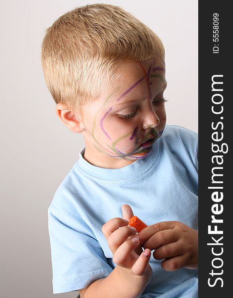 Laughing Toddler playing with colored pens making a mess. Laughing Toddler playing with colored pens making a mess