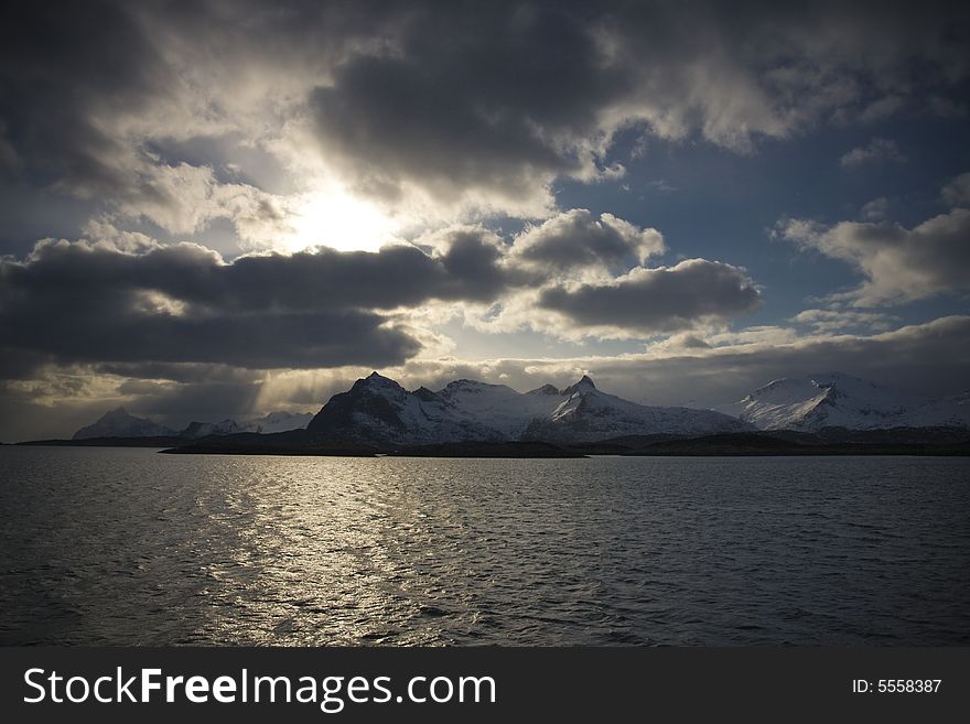 Snow-covered mountains at the Arctic ocean. Snow-covered mountains at the Arctic ocean