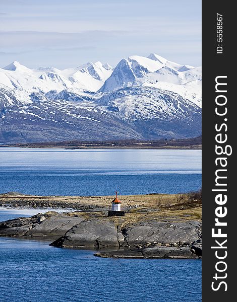 Snow-covered mountains at the Arctic ocean. Snow-covered mountains at the Arctic ocean