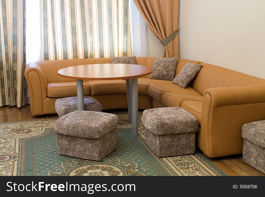 Sofa and round table in the suite. Sofa and round table in the suite