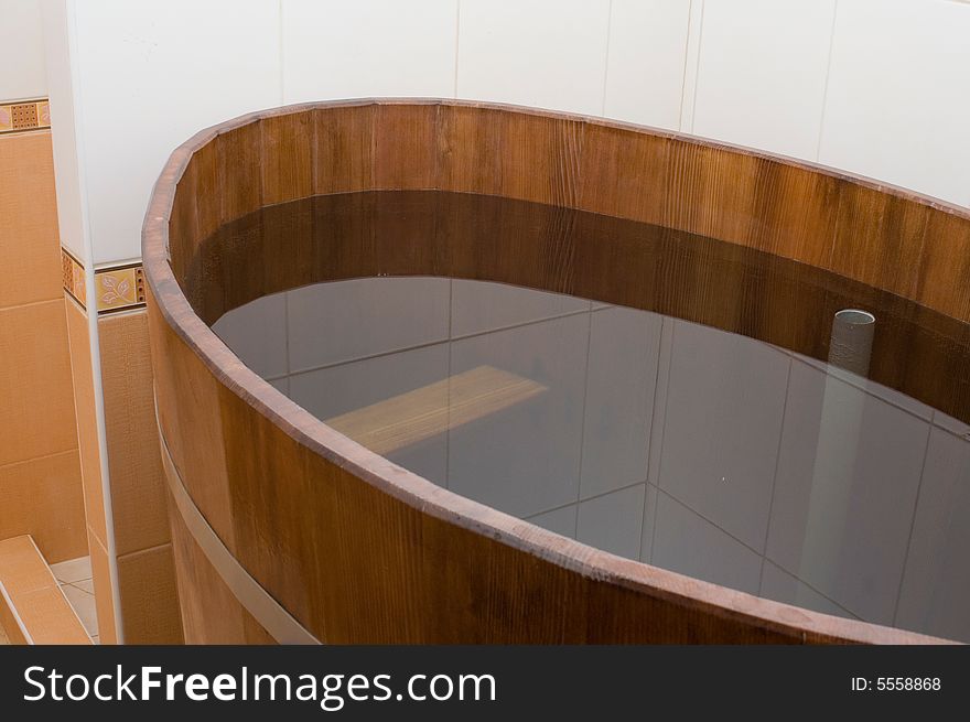 Wooden bath tub in the sauna