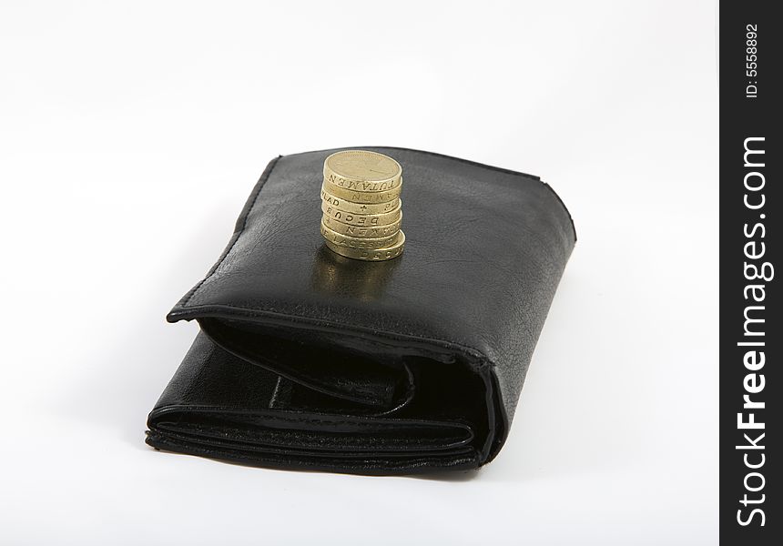 Black wallet with english pounds isolated on white bacground
