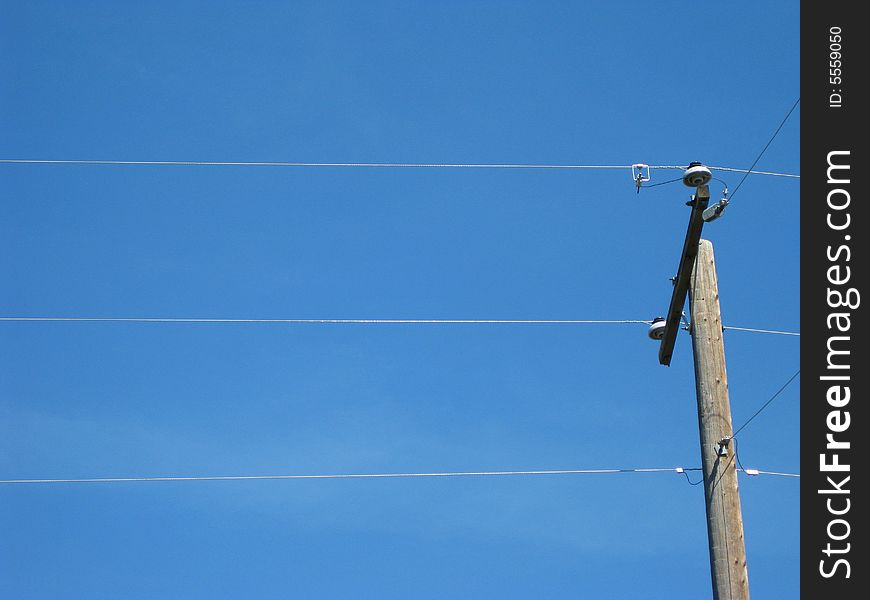 Simple power line below a clear sky. Simple power line below a clear sky.