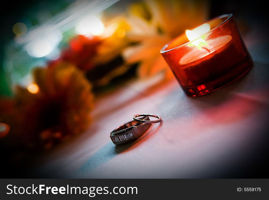 Wedding ring near a candle