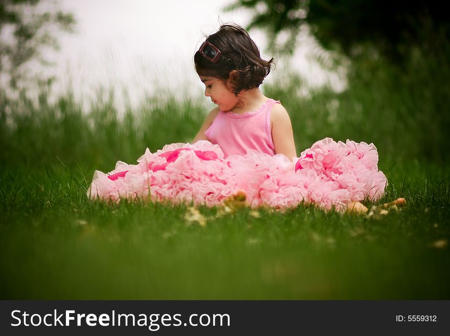 Cute girl in a flower garden wearing a cute pettiskirt. Cute girl in a flower garden wearing a cute pettiskirt