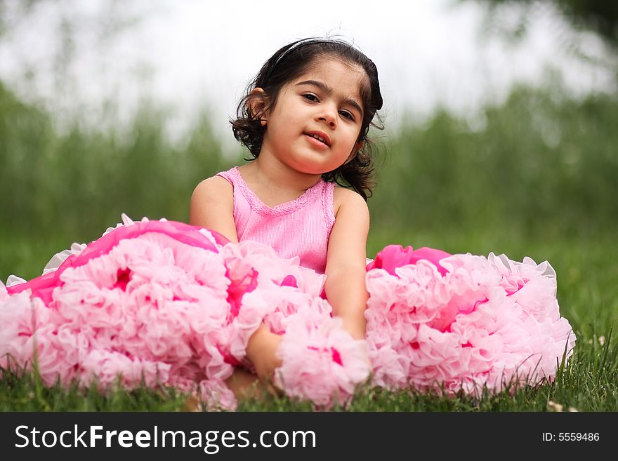 Cute girl in a flower garden wearing a cute pettiskirt. Cute girl in a flower garden wearing a cute pettiskirt