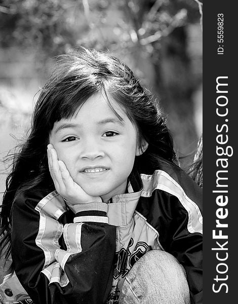 A black & white portrait of a cute young girl. A black & white portrait of a cute young girl.