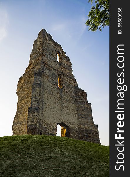 Church ruin on hill at sunrise