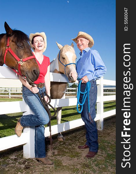 Two Farmers Smiling With Horses - Vertical