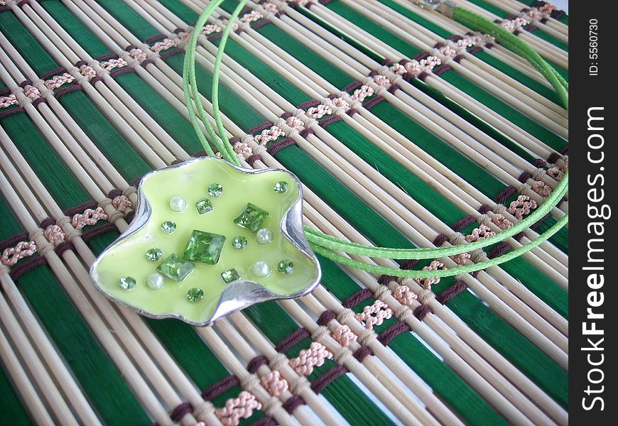 Beautiful green coulomb-leaf with beads