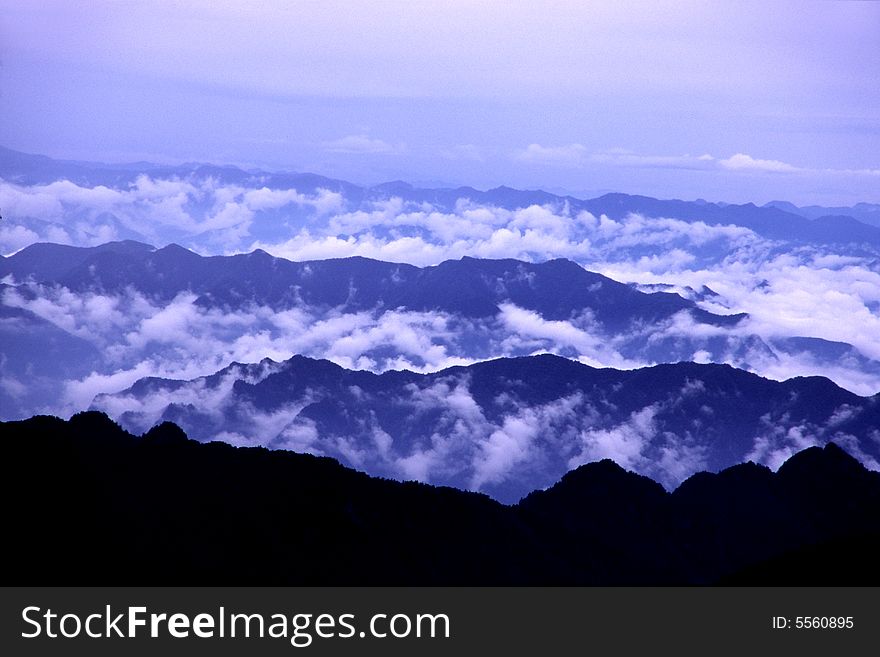 After the rain, clouds rises up from the mountains, viewing from the crest of taibaishan mountain, china. After the rain, clouds rises up from the mountains, viewing from the crest of taibaishan mountain, china