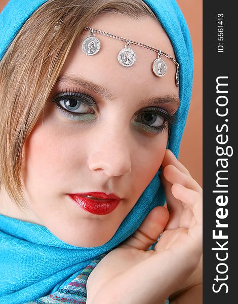 Female model with blue eyes wearing traditional folk dress