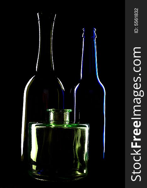An image of silhouettes of bottles on black background