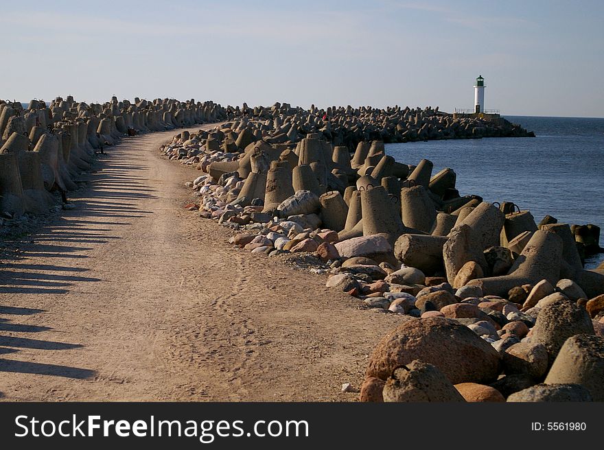 Pier in Baltic Sea near big port