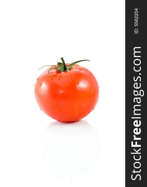 Single ripe red tomato isolated on the white background