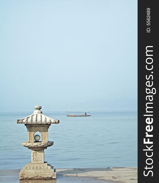 Little tower and boat on xizi lake, hangzhou city, china