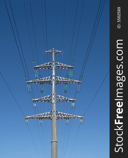 Electrical pylon on blue sky background. Electrical pylon on blue sky background