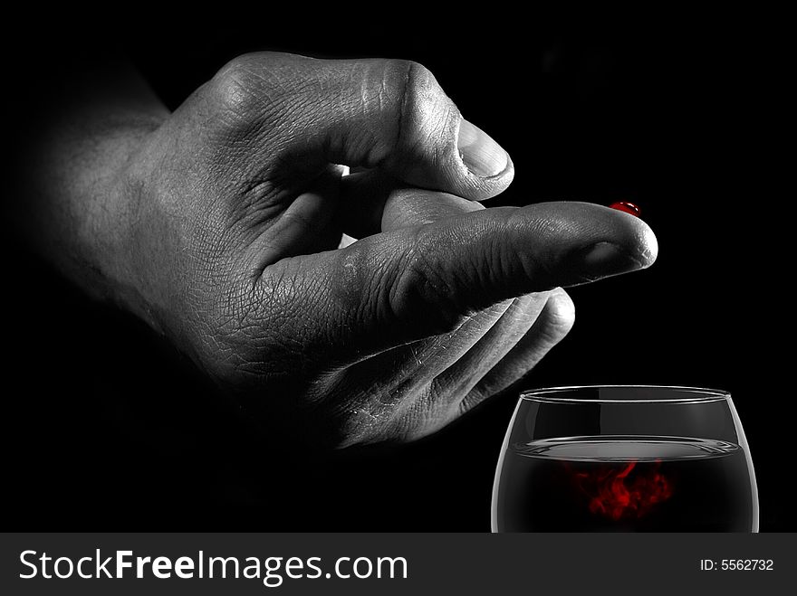 Hand with drop of blood