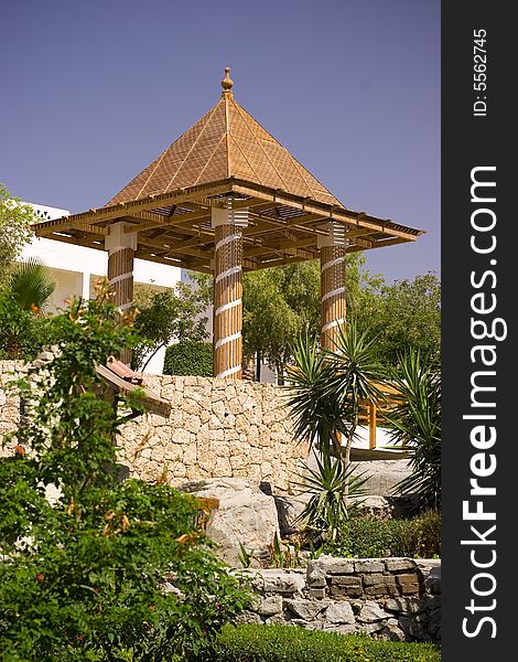 Beautiful tropical garden with decorative pavilion
