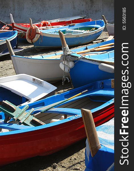 Coloured boats on a beach