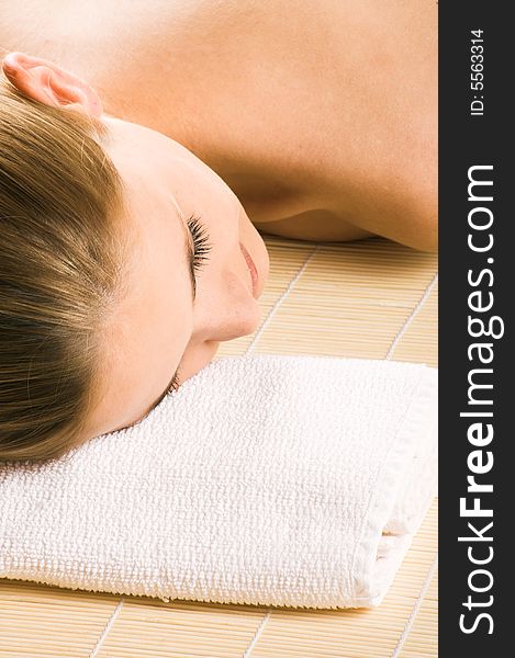 Young beautiful woman in a spa with towels. Young beautiful woman in a spa with towels