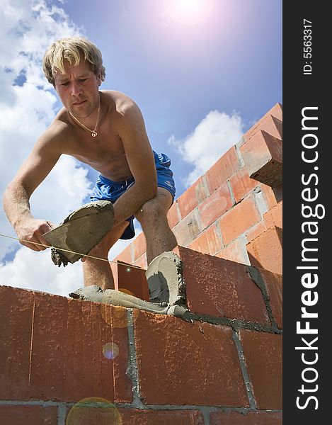 Construction worker building a wall