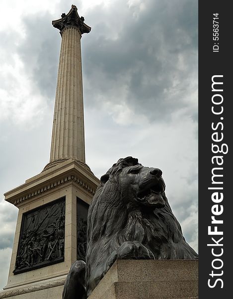 Vertical view of the Nelson Column in Trafalgar Square,London with a bronze lion. Vertical view of the Nelson Column in Trafalgar Square,London with a bronze lion