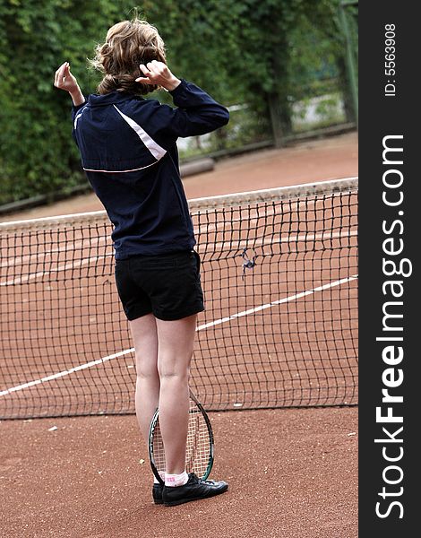 A tennis player girl in action