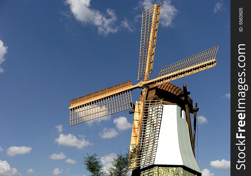 Old mill on a background of the light-blue sky. Old mill on a background of the light-blue sky